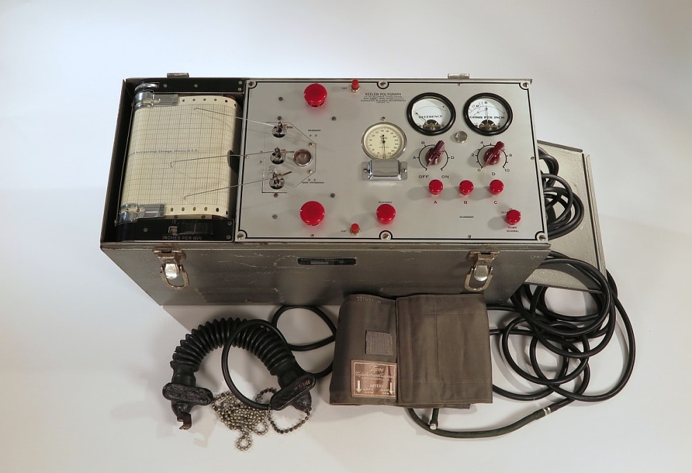 This device carries inscriptions that lend it its historic identity: "KEELER POLYGRAPH / U.S. PAT. NO. 1,788,844 OTHERS PENDING / MODEL 302C / SERIAL NO. 3020331 / ASSOCIATED RESEARCH INCORPORATED / CHICAGO, ILL." and "ASSOCIATED RESEARCH / Incorporated / CHICAGO / ILL / MODEL NO. 302C / SERIAL NO. 3020331 / MADE IN USA."The inventor of this piece, Leonarde Keeler (1903-1949), played a critical role in advancing and popularizing polygraphs, initiating his work in California before continuing in Chicago. Associated Research, Inc., a company founded by James F. Inman (1902-1959) in Chicago in 1936, was involved in repairing and manufacturing electrical instruments. For more information, one can refer to the patent filed by Leonarde E. Keeler, titled “Apparatus for Recording Arterial Blood Pressure,” U.S. Patent 1,788,484, which was issued on January 13, 1931. Further details about Keeler's life and his contribution to lie detection technology are documented in a Chicago Tribune article, "Keeler, Famed As Inventor Of Lie Test, Dies" (September 21, 1949), on page 30.